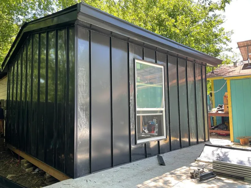 Black standing seam metal wall panels for Metal Roof Installation in Portales